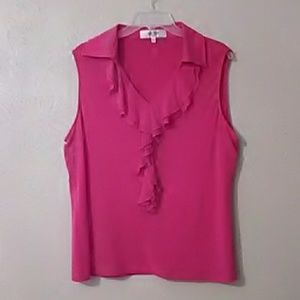 Pink sleevless blouse,with ruffle down the front.